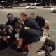 Screenshot of officers restraining Luis Rodriguez
YouTube